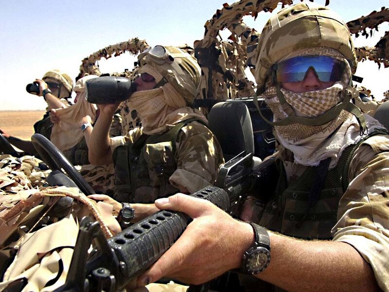 Soldiers in desert vehicle