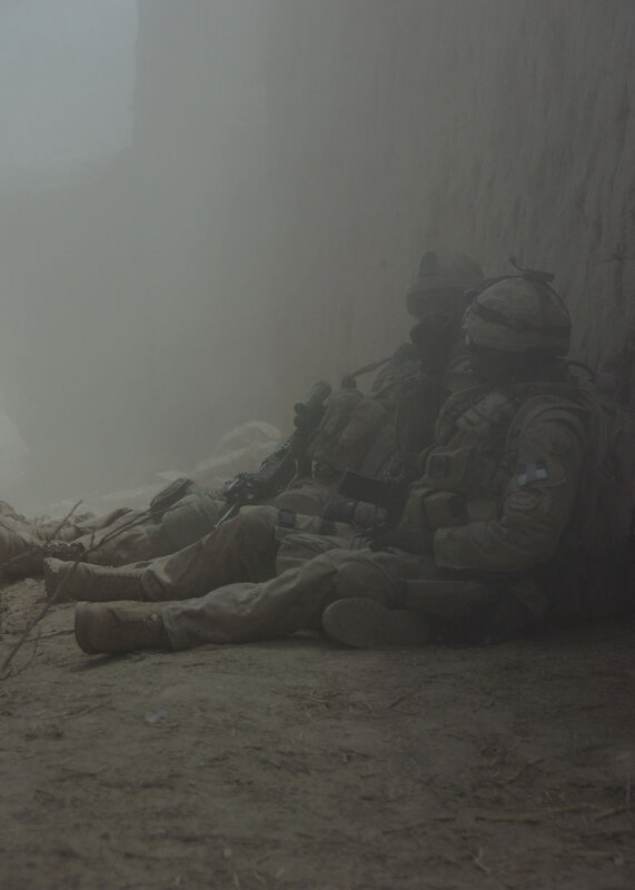 Soldiers in dusty trench