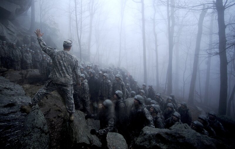 Soldiers in foggy forest