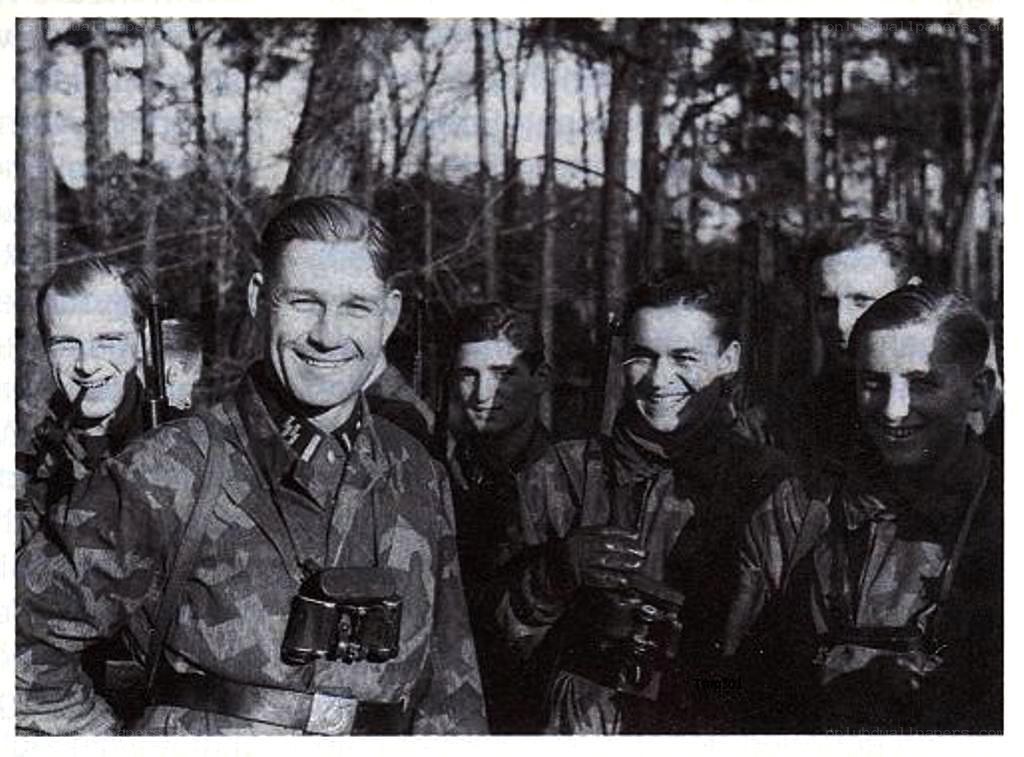 Soldiers in forest smiling