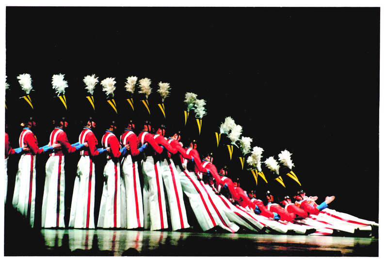 Soldiers in formation on stage