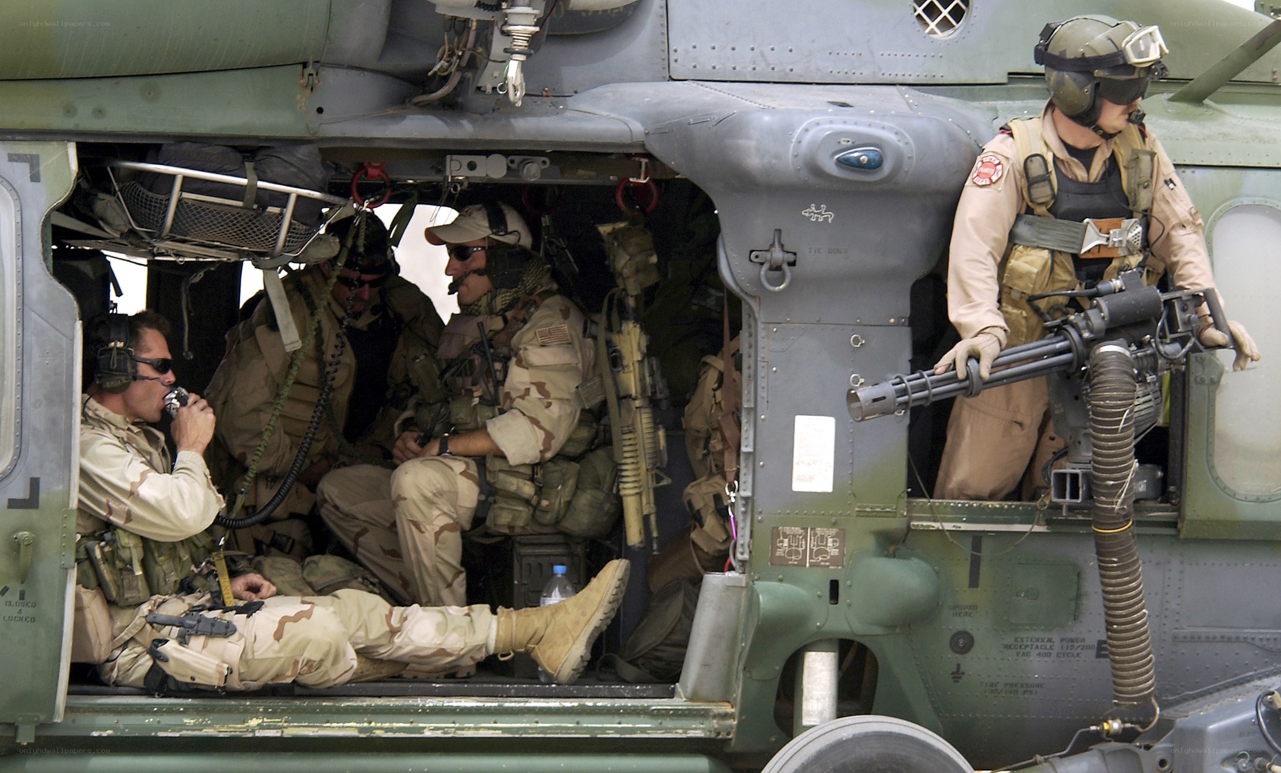 Soldiers in helicopter during mission