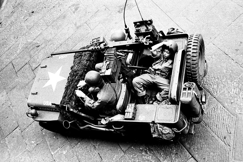 Soldiers in military vehicle