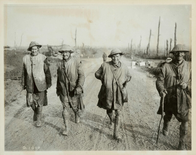 Soldiers in muddy trench