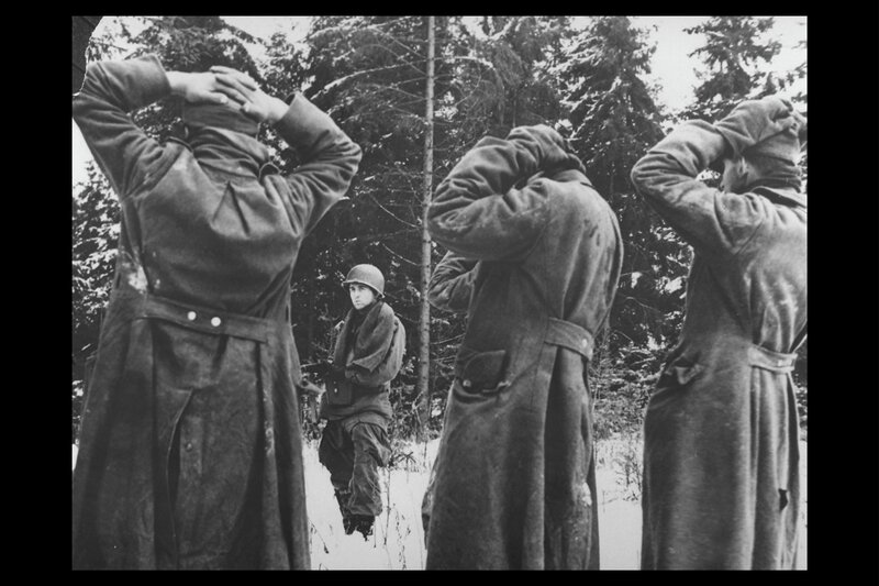 Soldiers in snowy forest