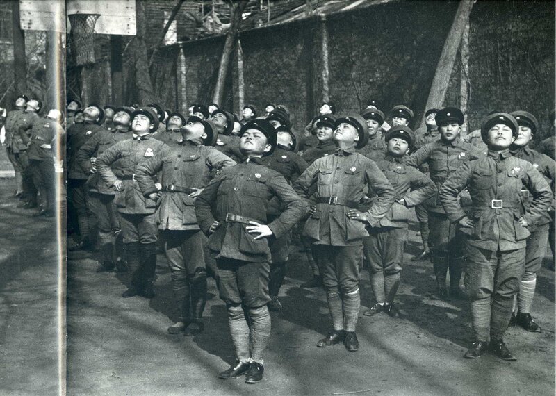 Soldiers in uniform standing at attention