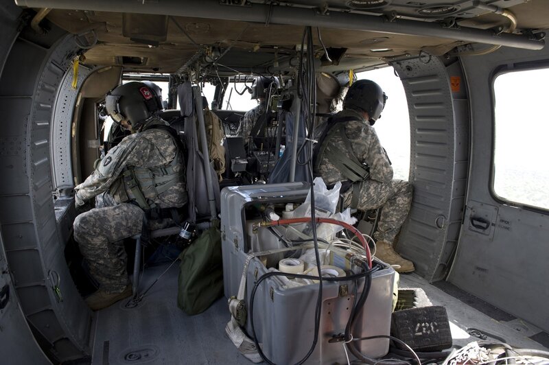 Soldiers inside a military helicopter