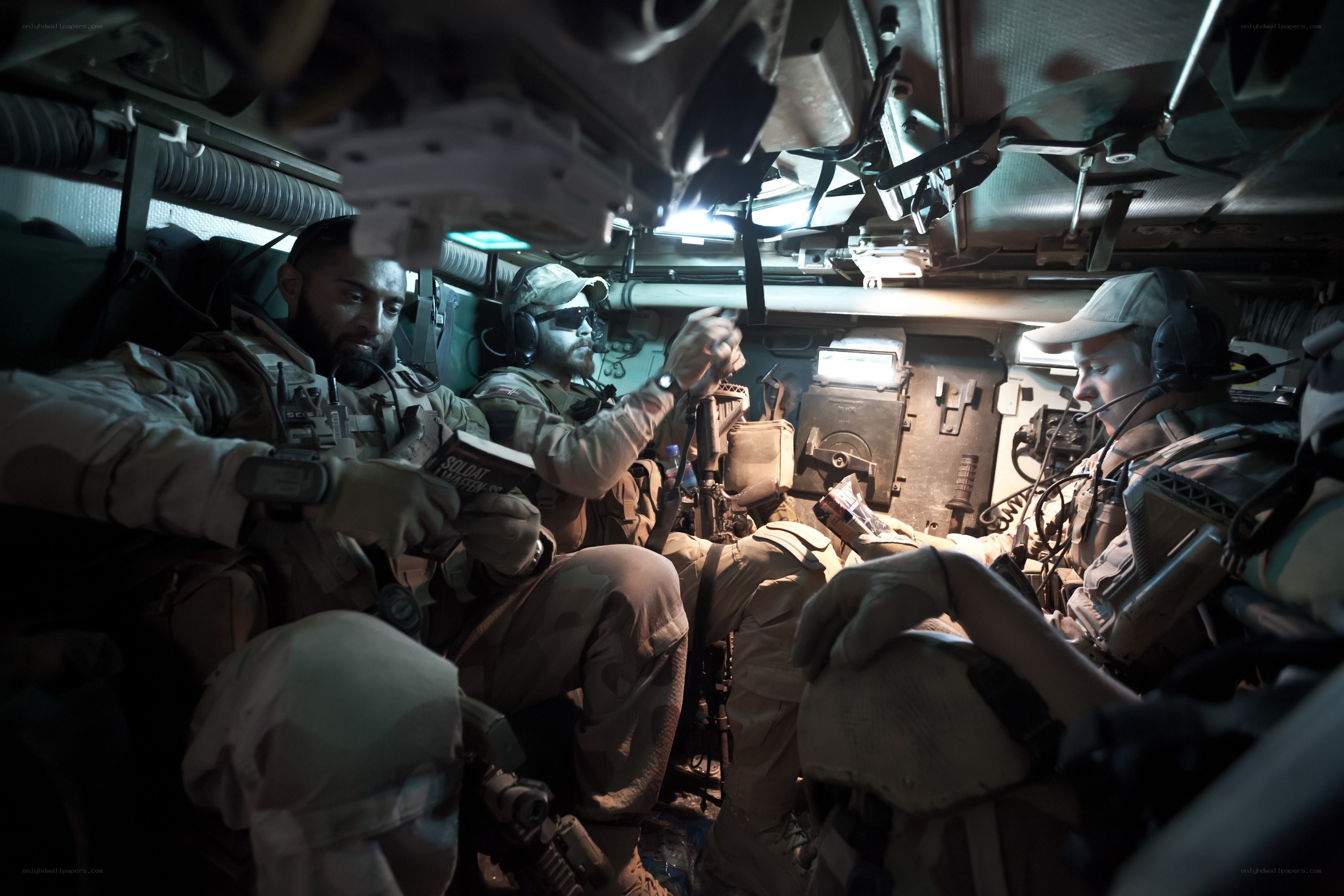 Soldiers inside armored vehicle