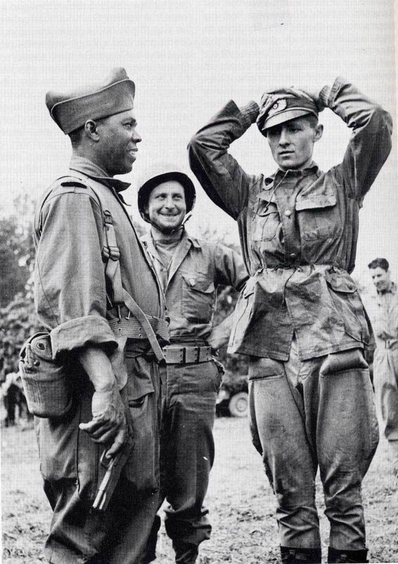 Soldiers interacting in field