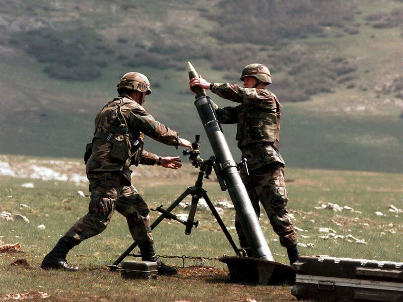 Soldiers loading a rocket launcher