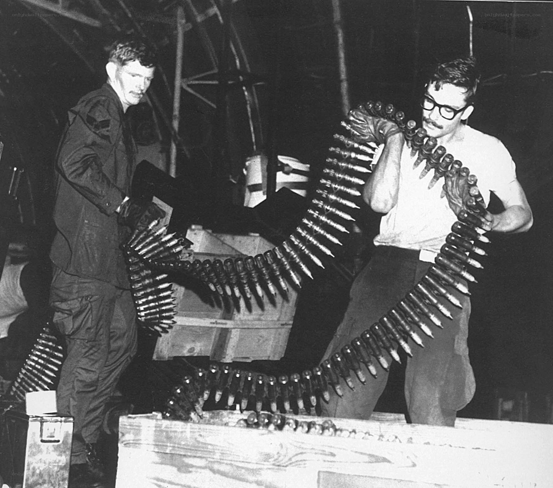 Soldiers loading ammunition belts