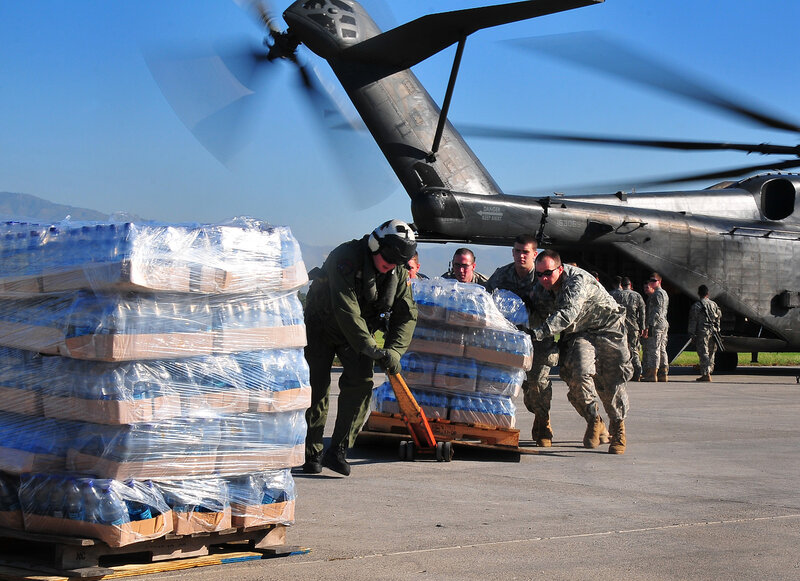 Soldiers loading water supplies