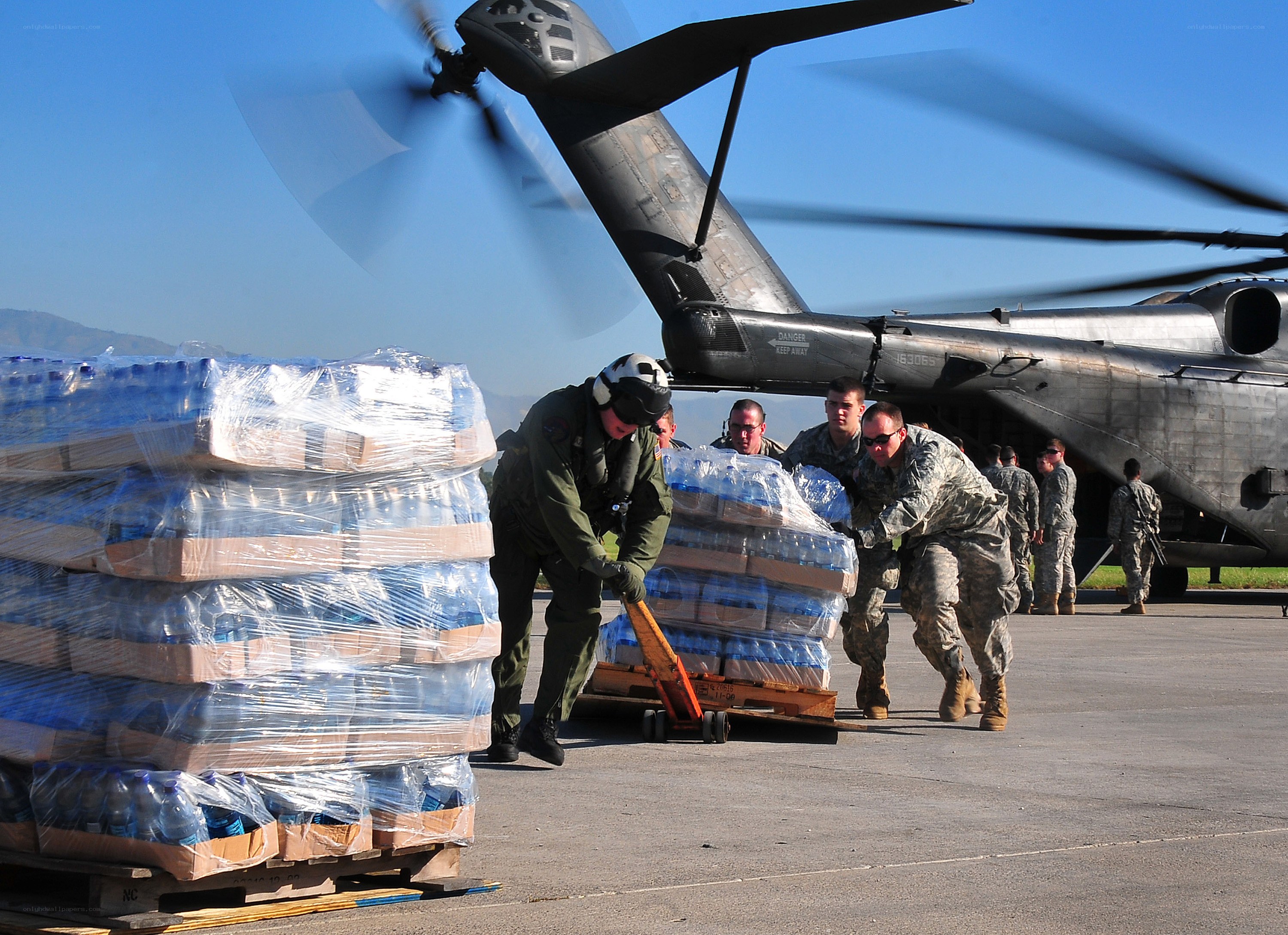 Soldiers loading water supplies
