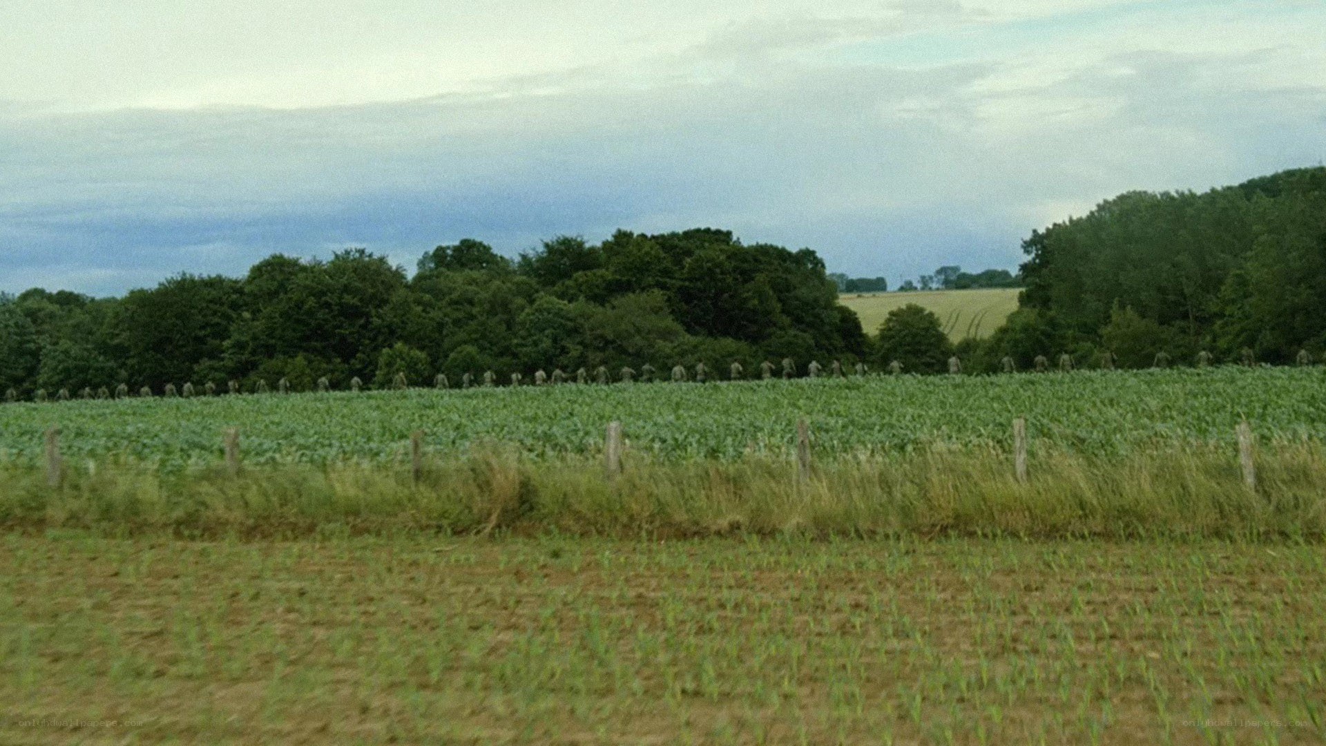 Soldiers marching in a field