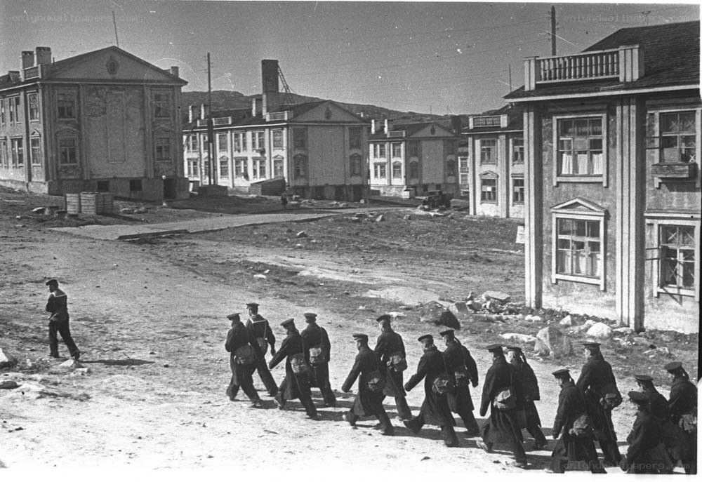 Soldiers marching in a town