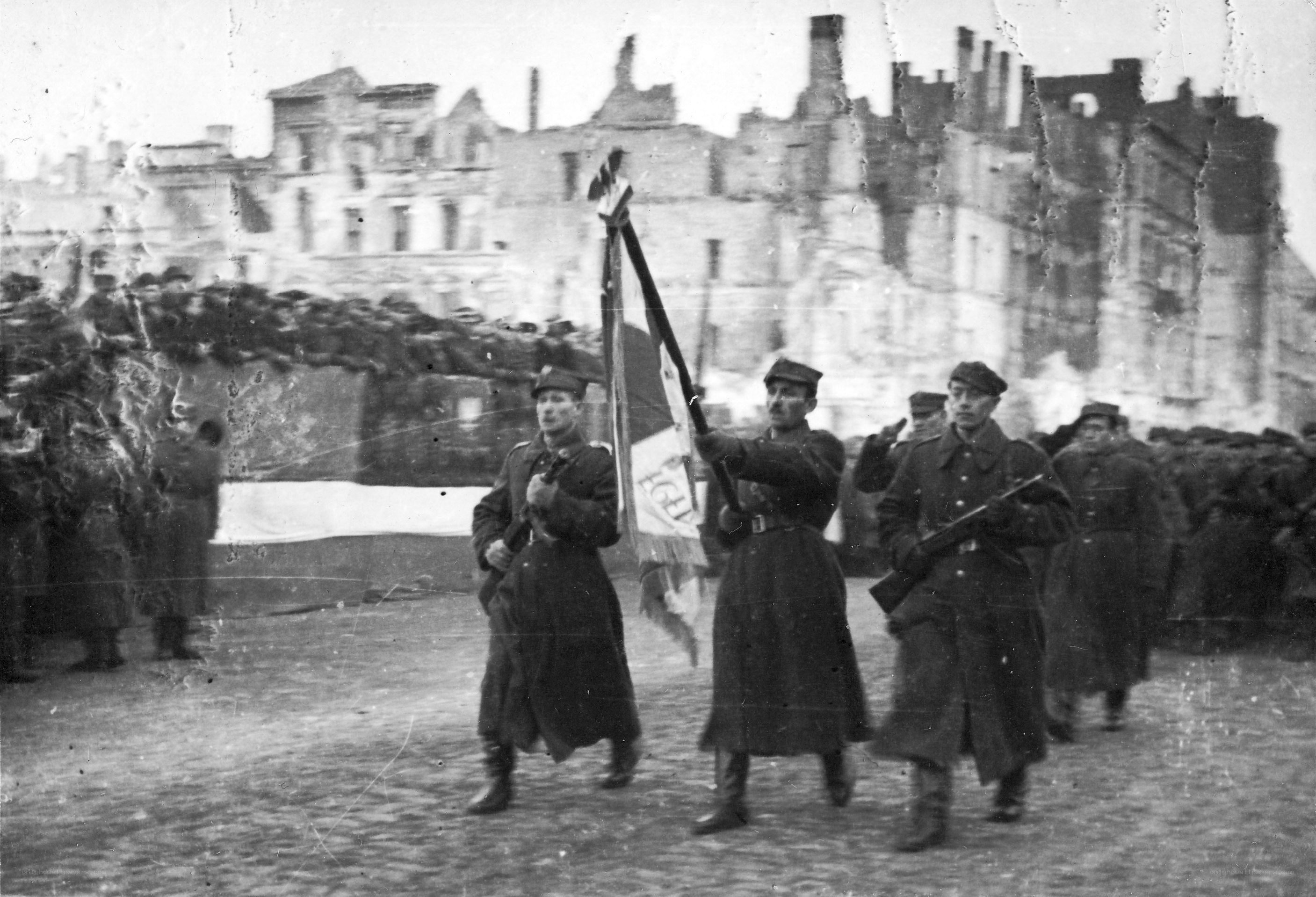Soldiers marching in a war-torn city