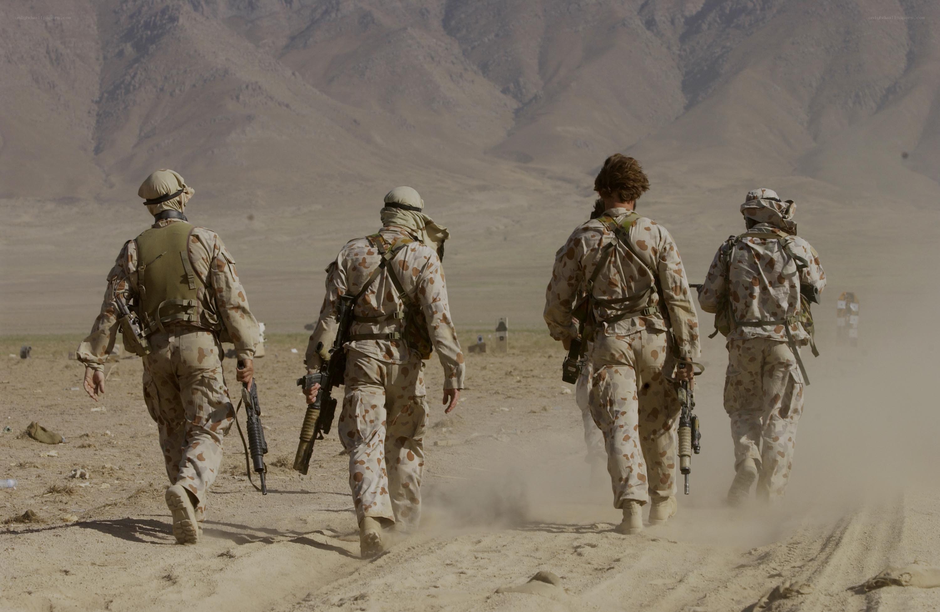 Soldiers marching in desert
