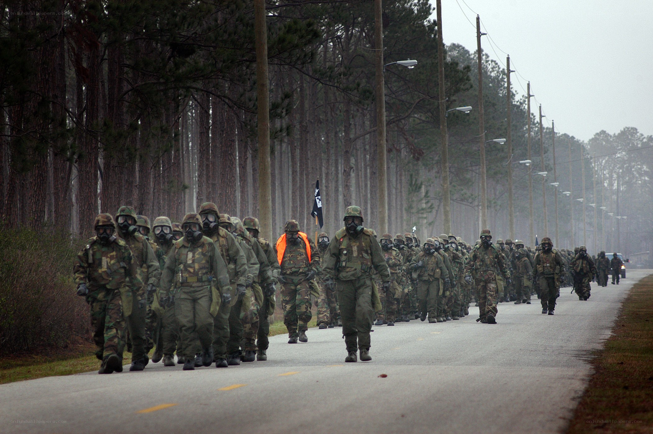 Soldiers marching in gas masks