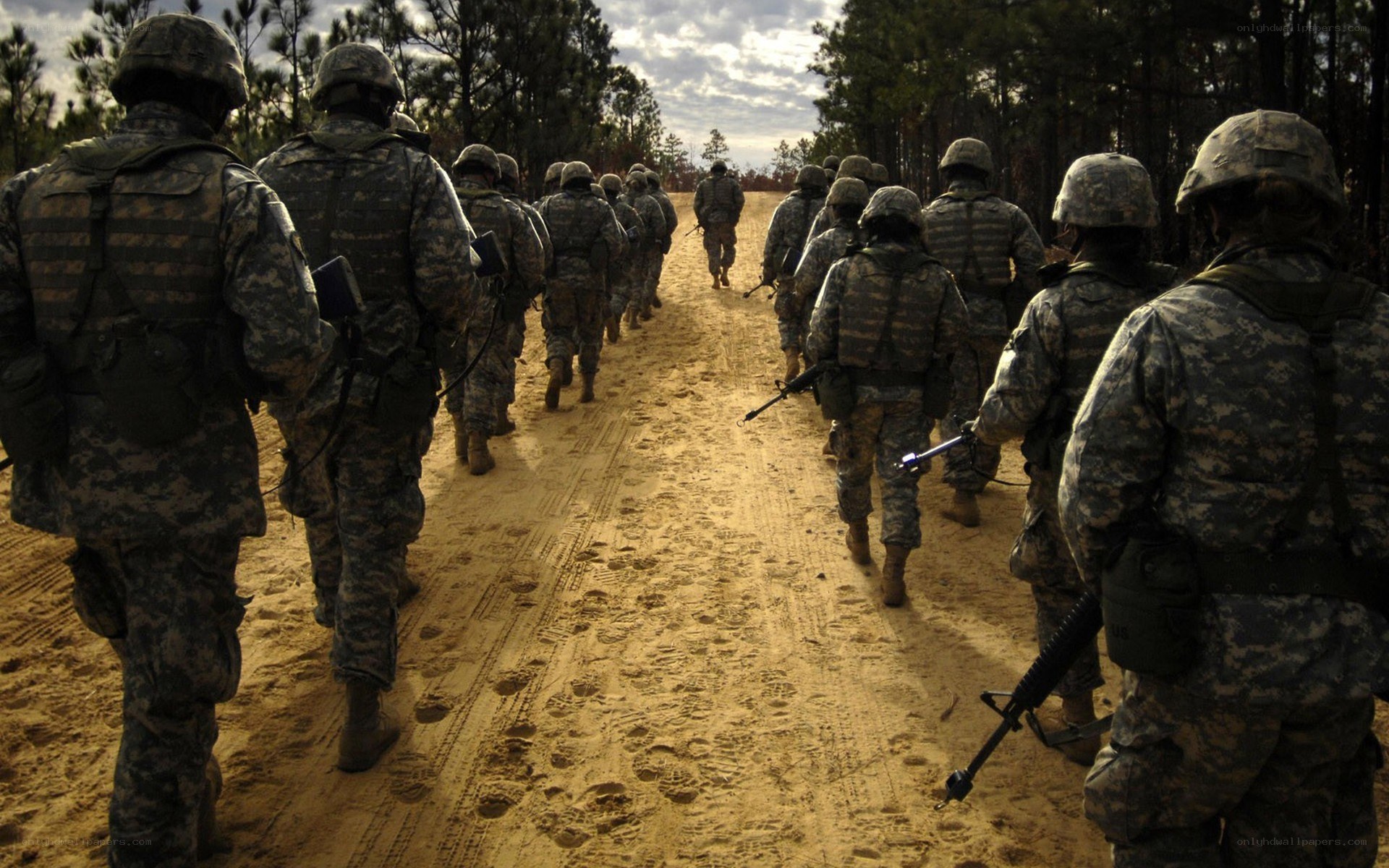 Soldiers marching on a dirt road