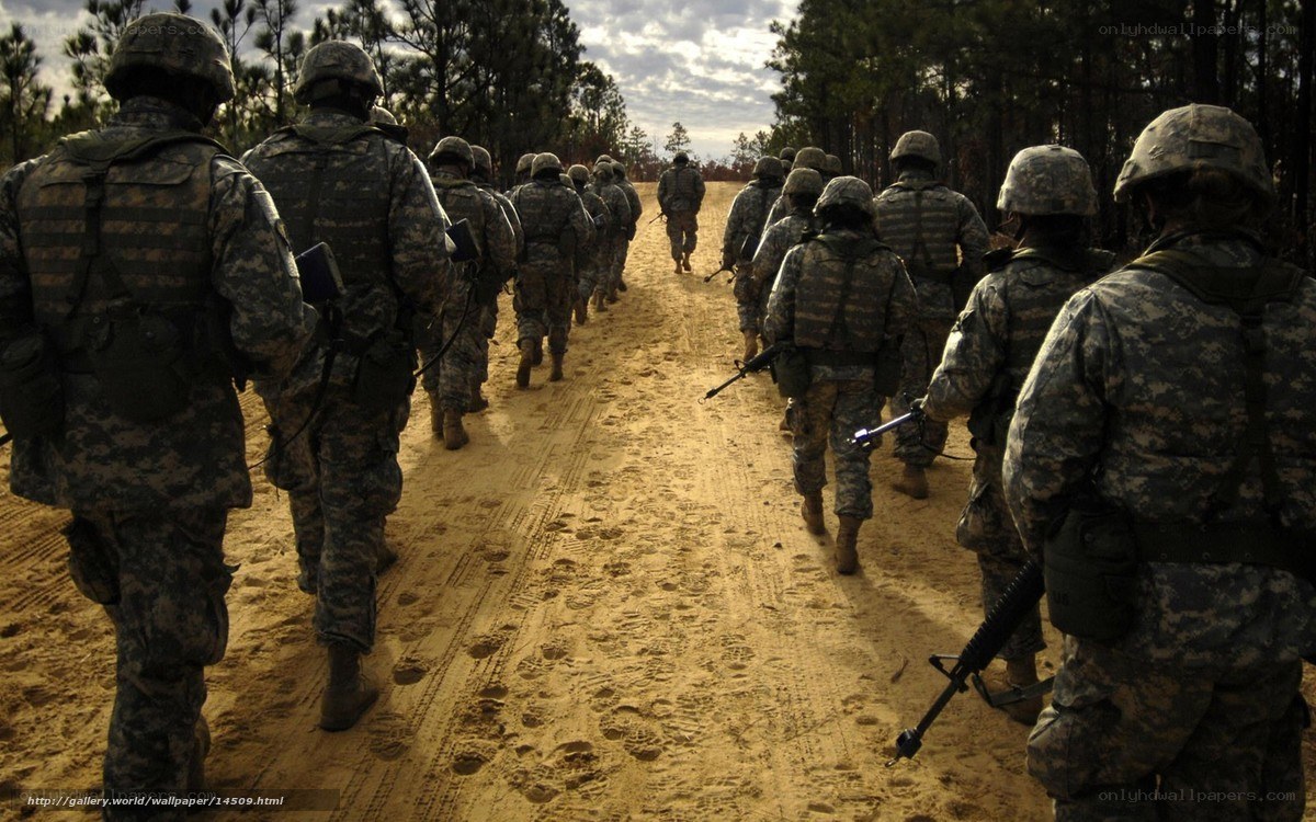 Soldiers marching on dirt road