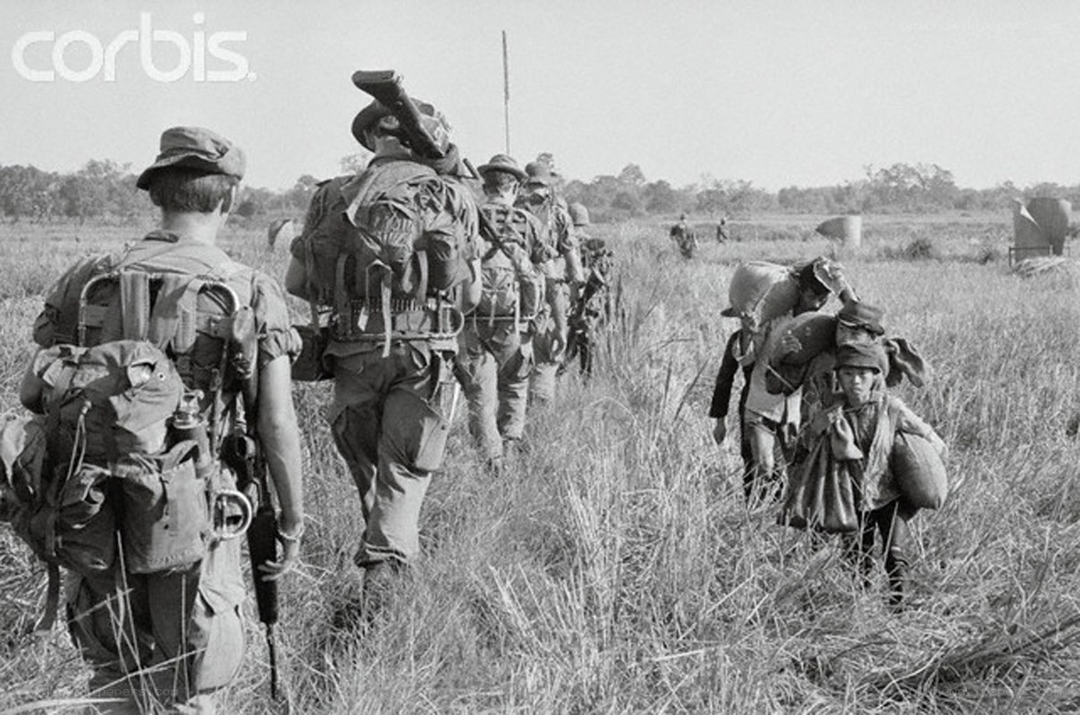 Soldiers marching through a field