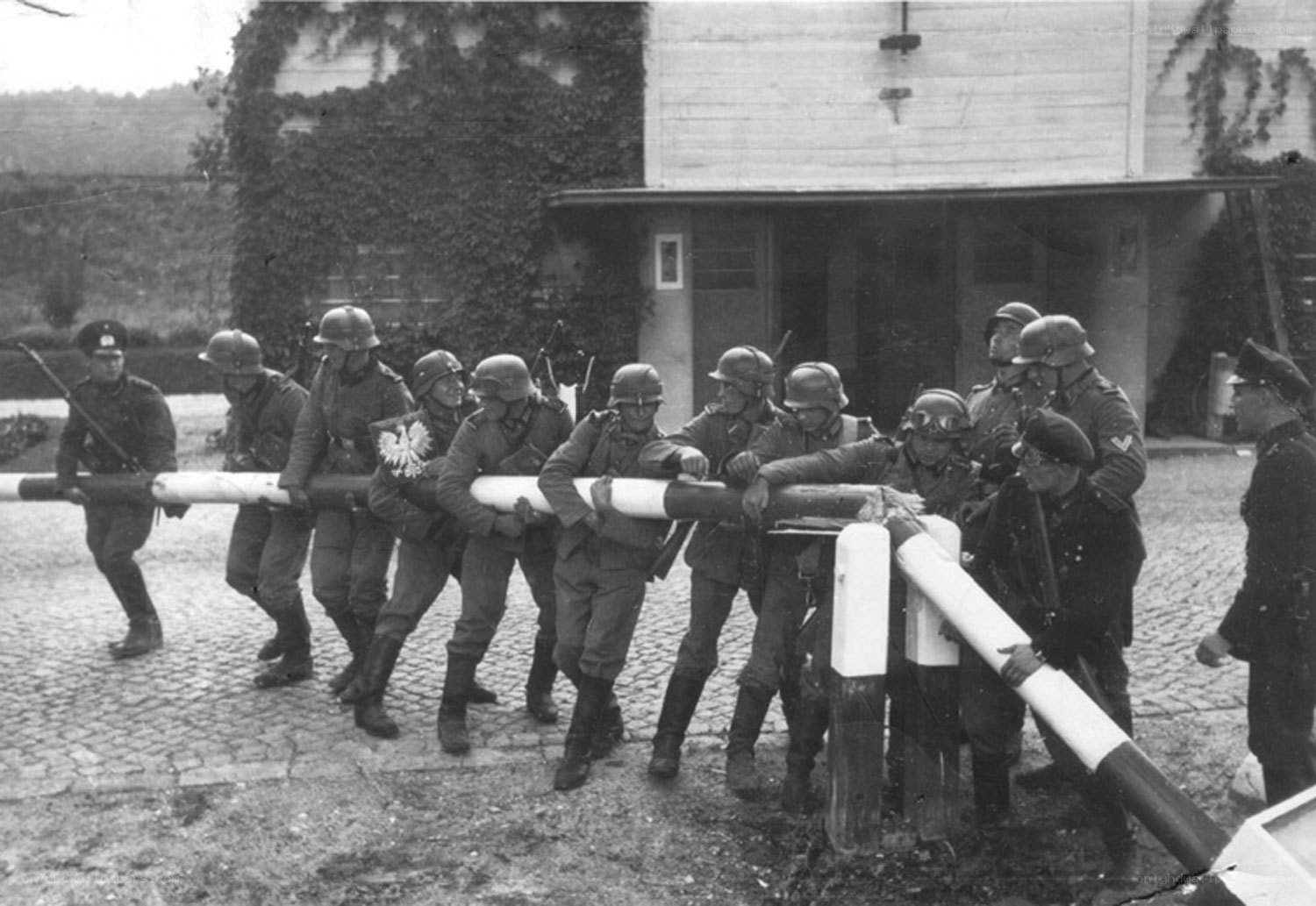 Soldiers moving a barrier