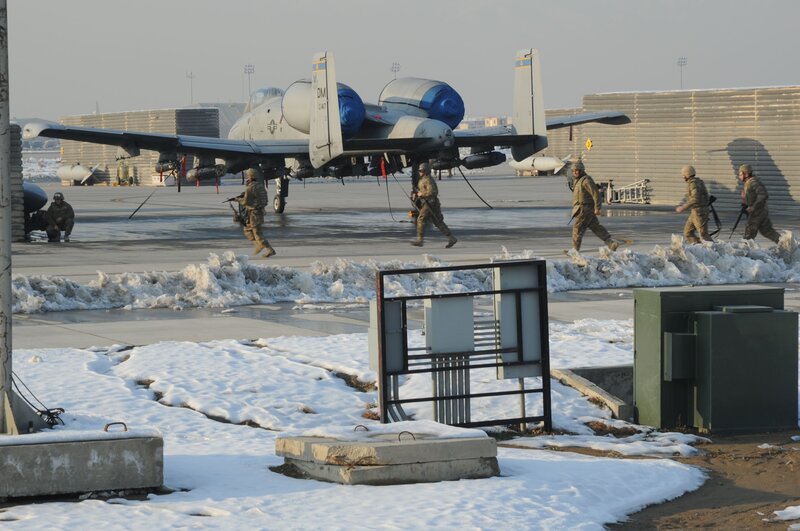 Soldiers near A-10 aircraft