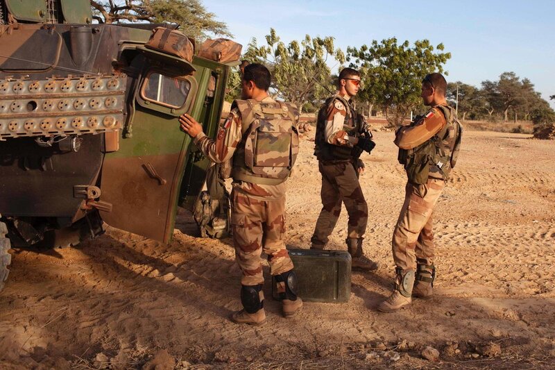 Soldiers near armored vehicle