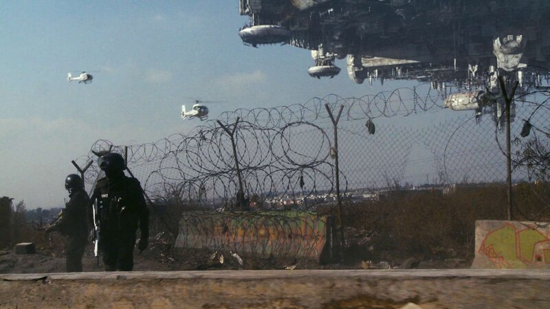 Soldiers near barbed wire fence