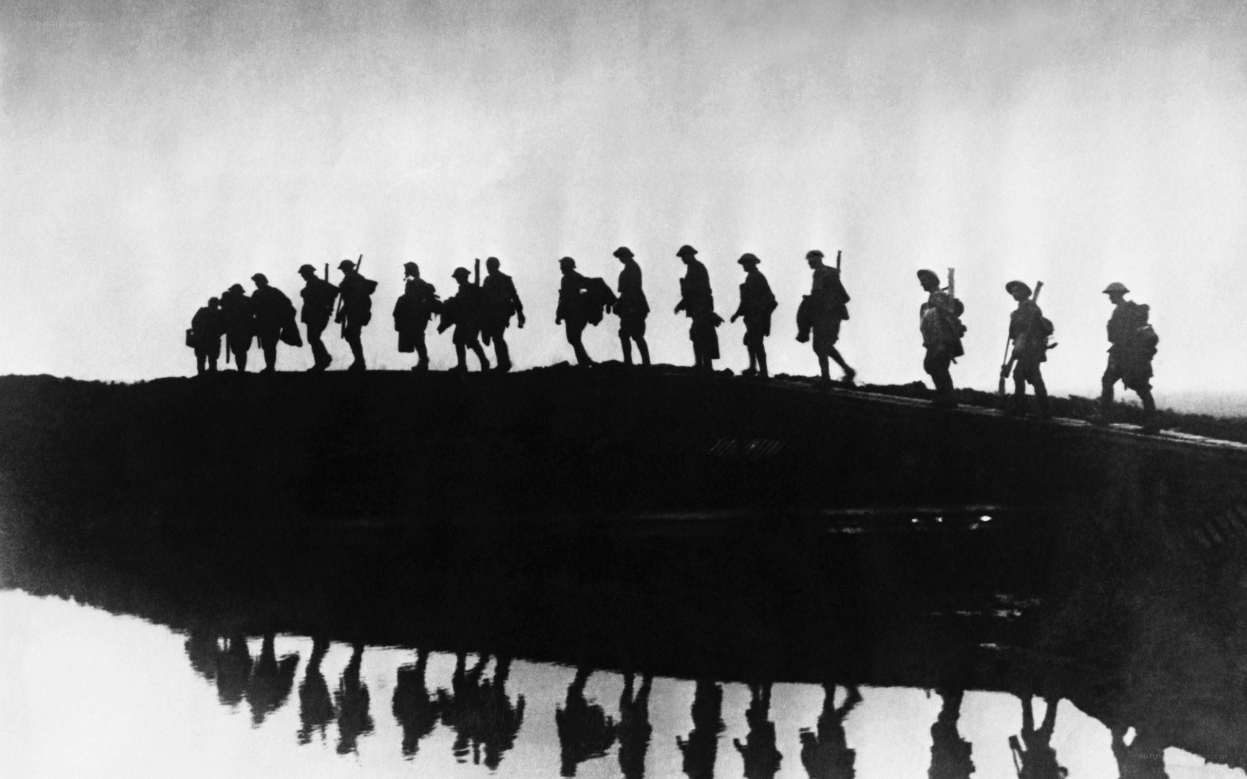 Soldiers on a bridge at dawn