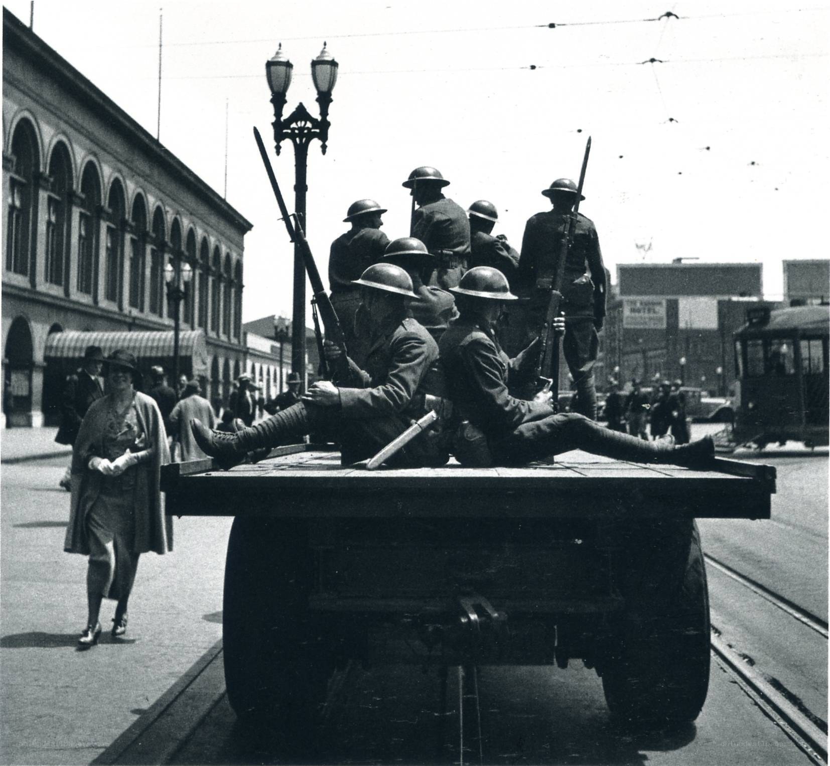 Soldiers on a flatbed truck