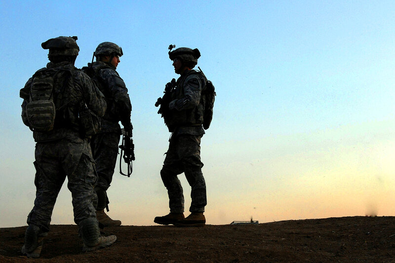 Soldiers on a hill at dusk