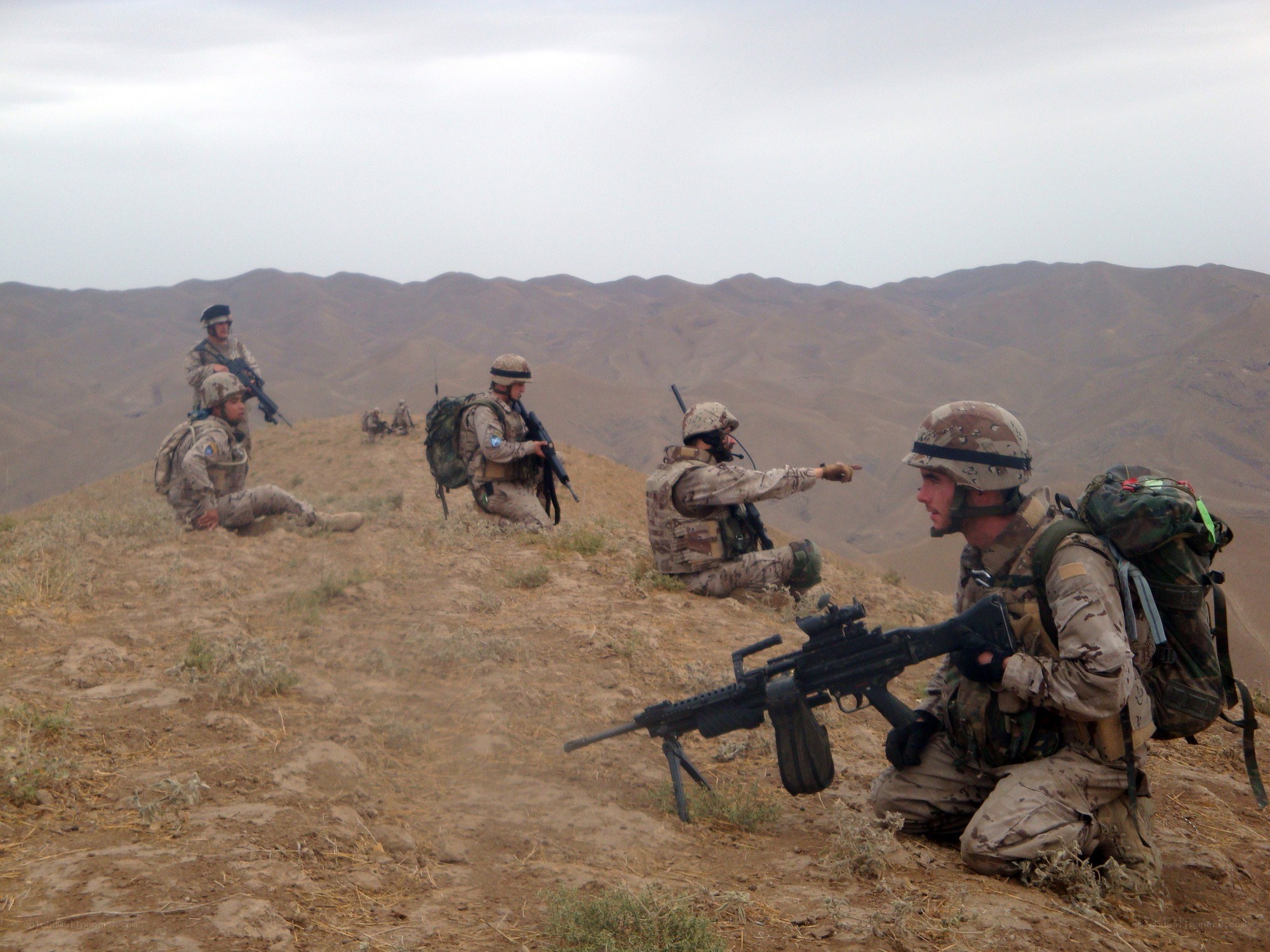Soldiers on a hilltop patrol