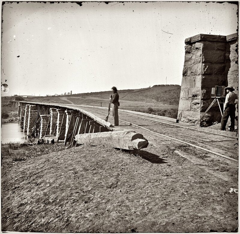 Soldiers on a railway bridge