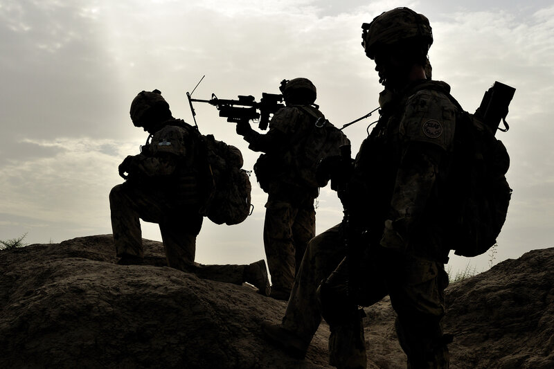 Soldiers on a rocky outcrop