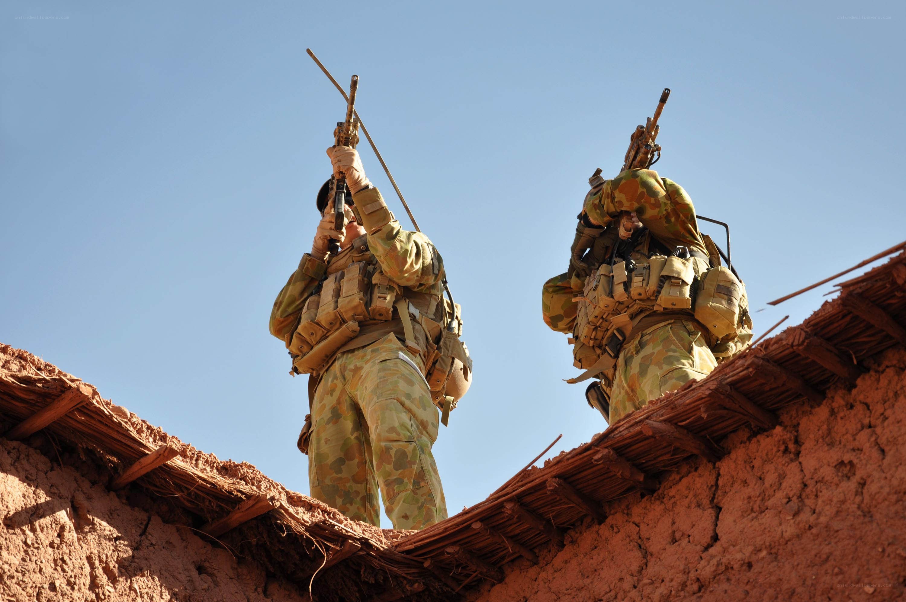 Soldiers on a rooftop