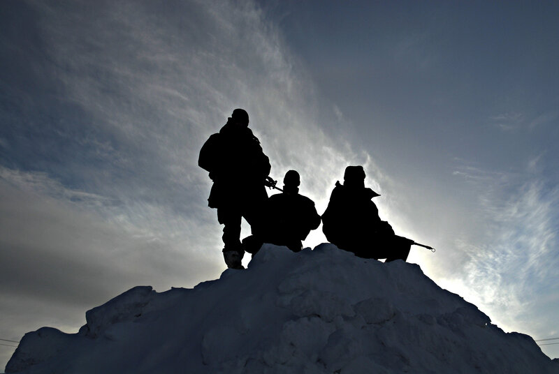 Soldiers on a snowy hill
