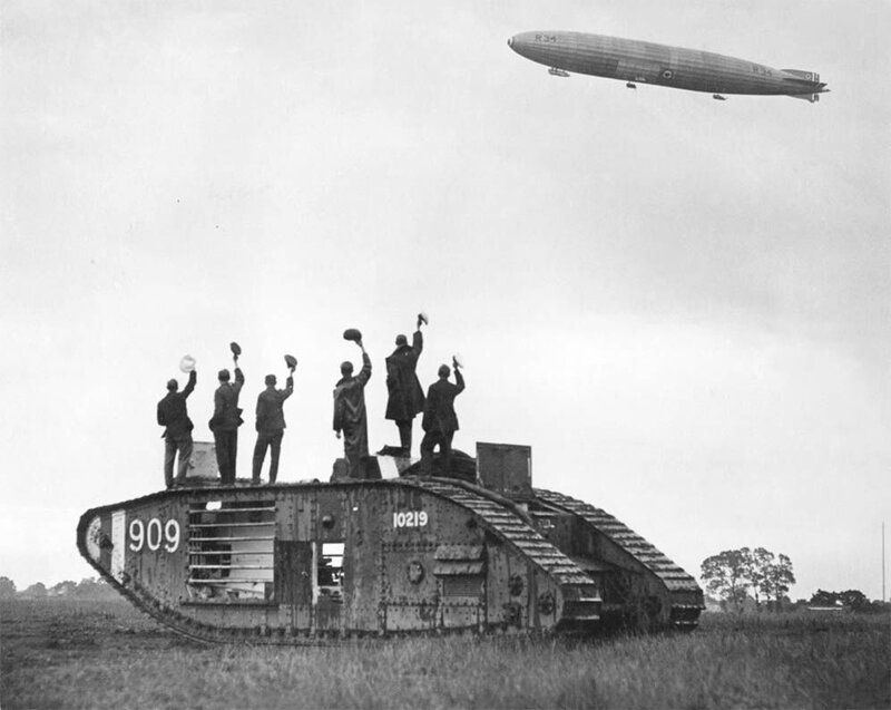 Soldiers on a tank with an airship