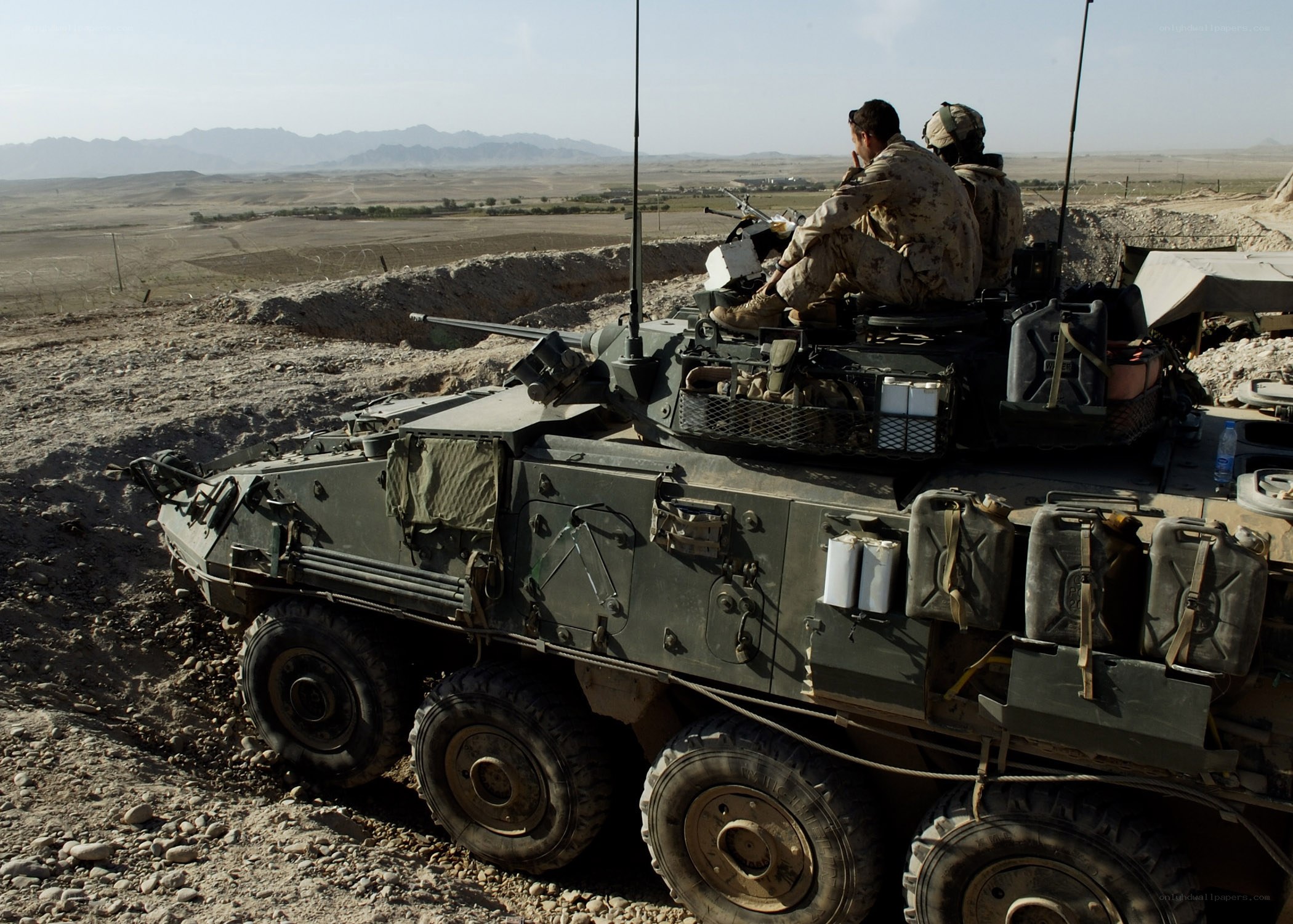 Soldiers on armored vehicle