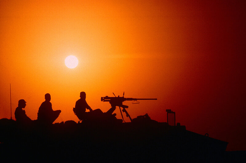 Soldiers on Armored Vehicle — Orange