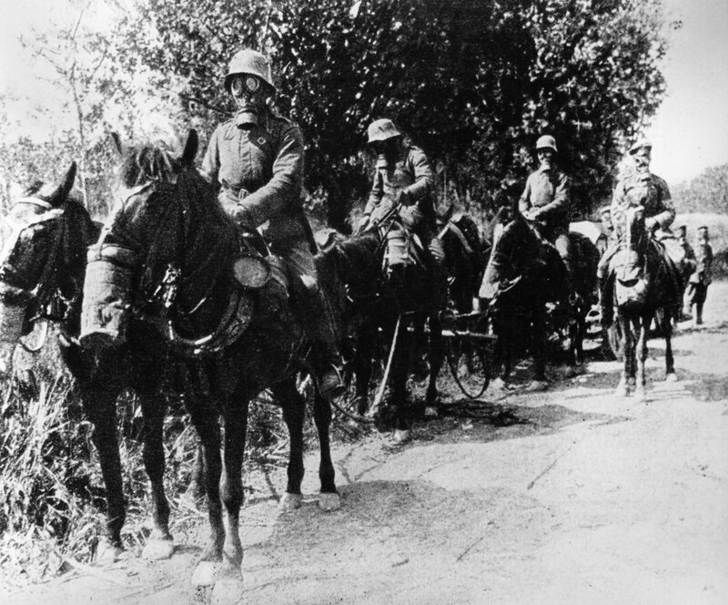 Soldiers on horseback with gas masks