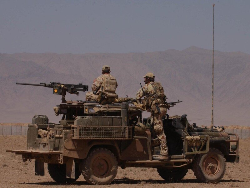 Soldiers on military vehicle