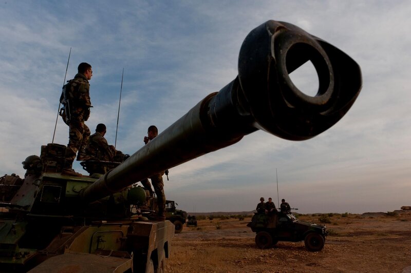 Soldiers on military vehicles in desert