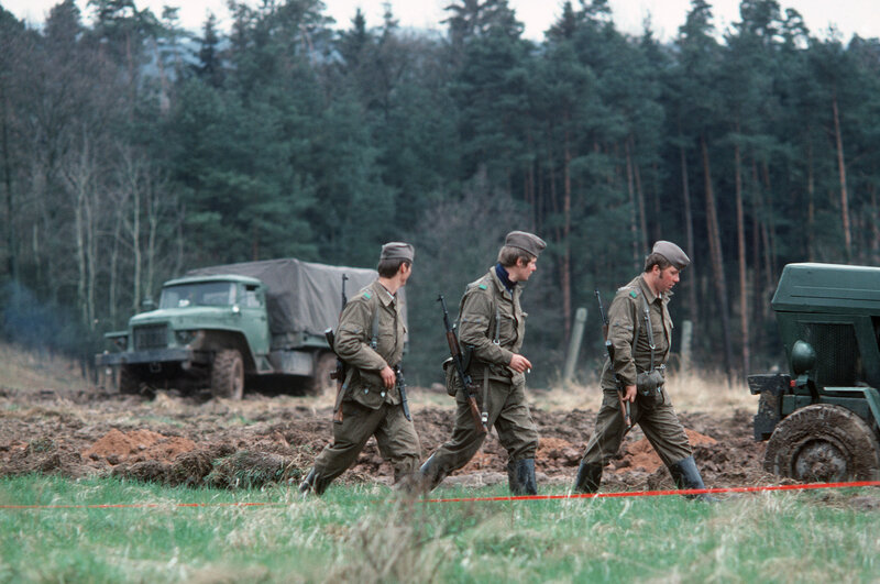 Soldiers on patrol in a field