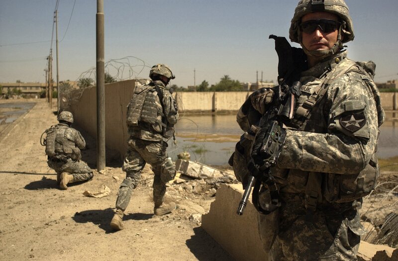 Soldiers on patrol in a war zone