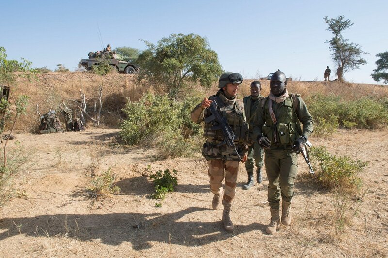 Soldiers on patrol in dry terrain