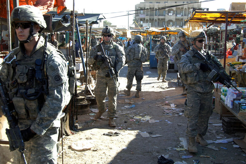 Soldiers on patrol in market