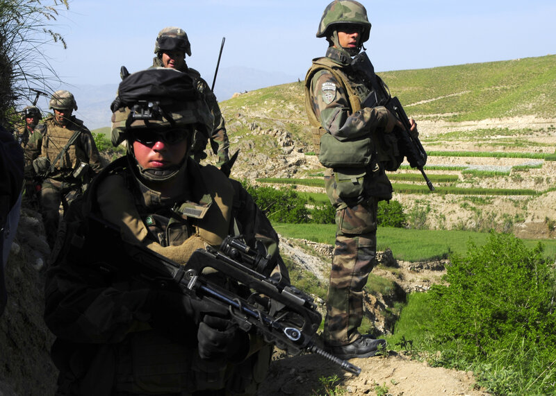 Soldiers on patrol in mountainous terrain