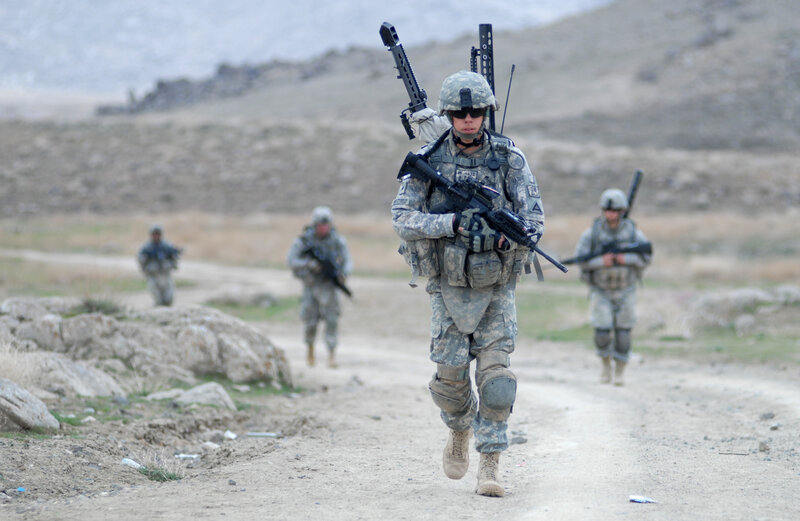Soldiers on patrol in mountainous terrain