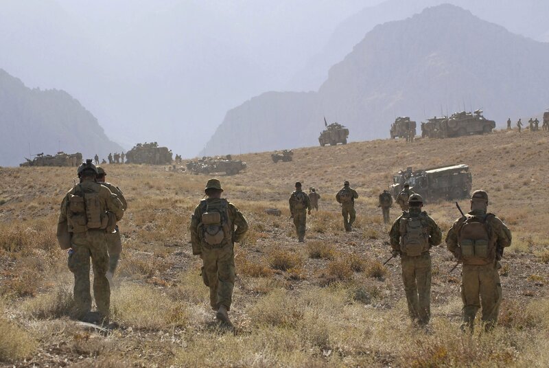 Soldiers on patrol in mountainous terrain
